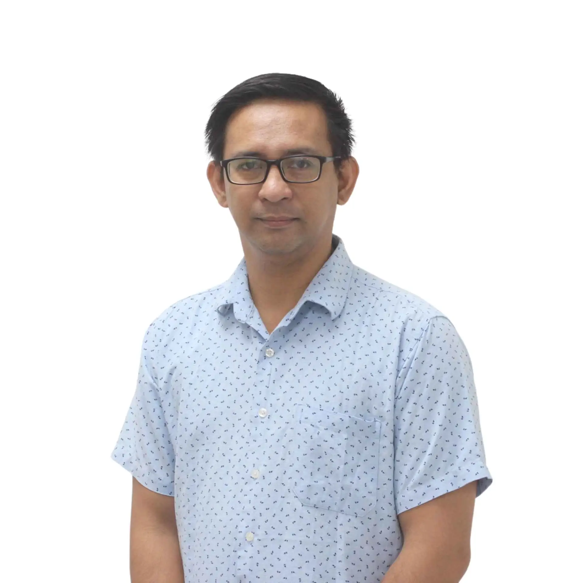 Portrait of a male team member in a patterned light blue shirt, wearing glasses.