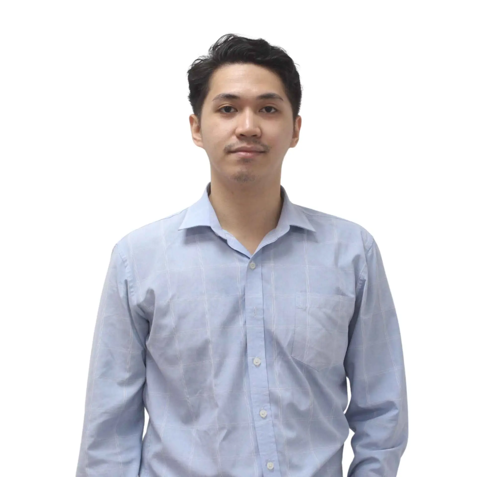 Professional headshot of a team member in a light blue shirt against a white background.