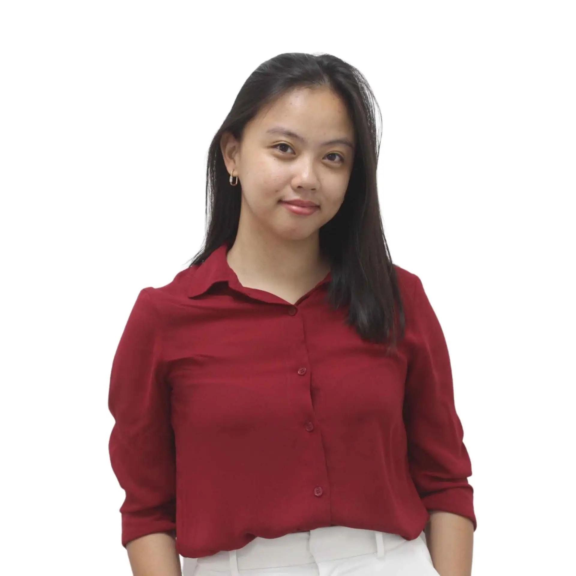 Headshot of a female team member in a red blouse, posing confidently against a white background.