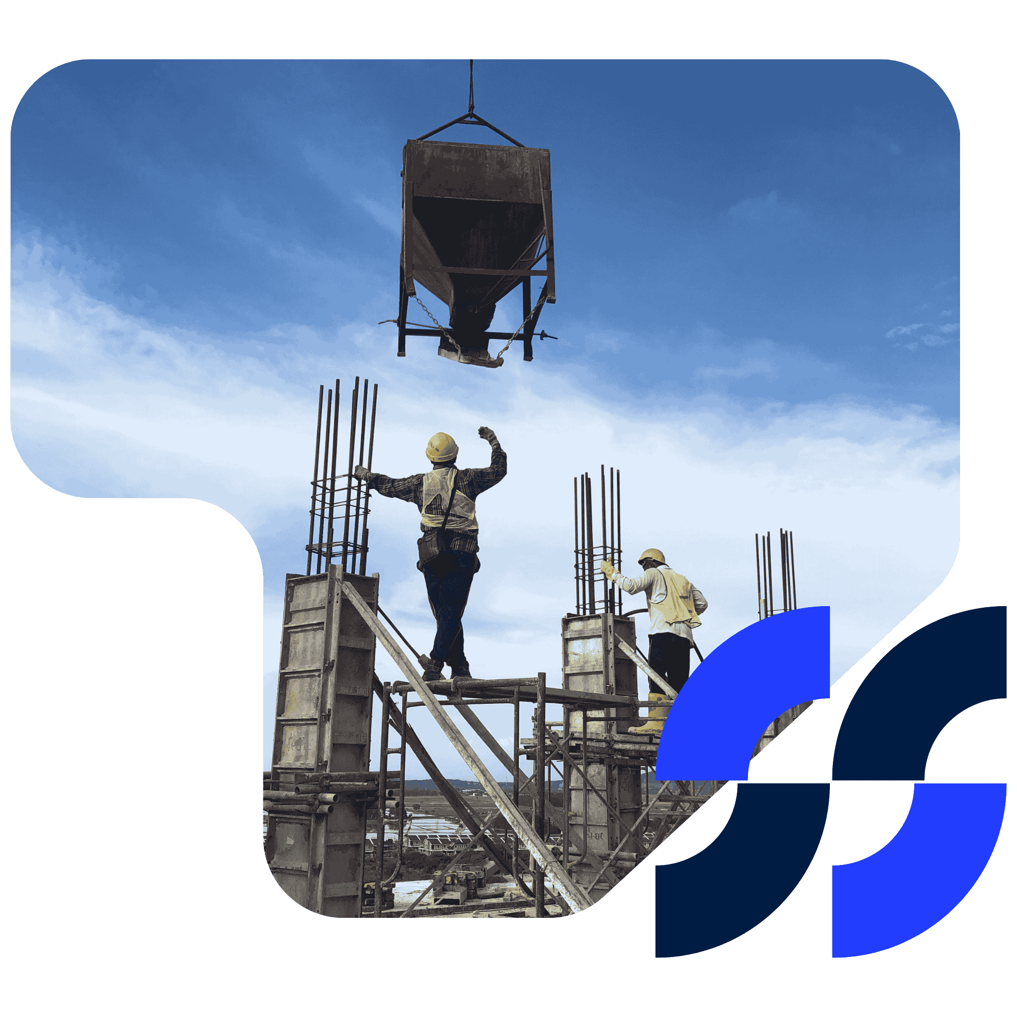 Two construction workers manage the placement of a cement pour from a suspended hopper on a building site.