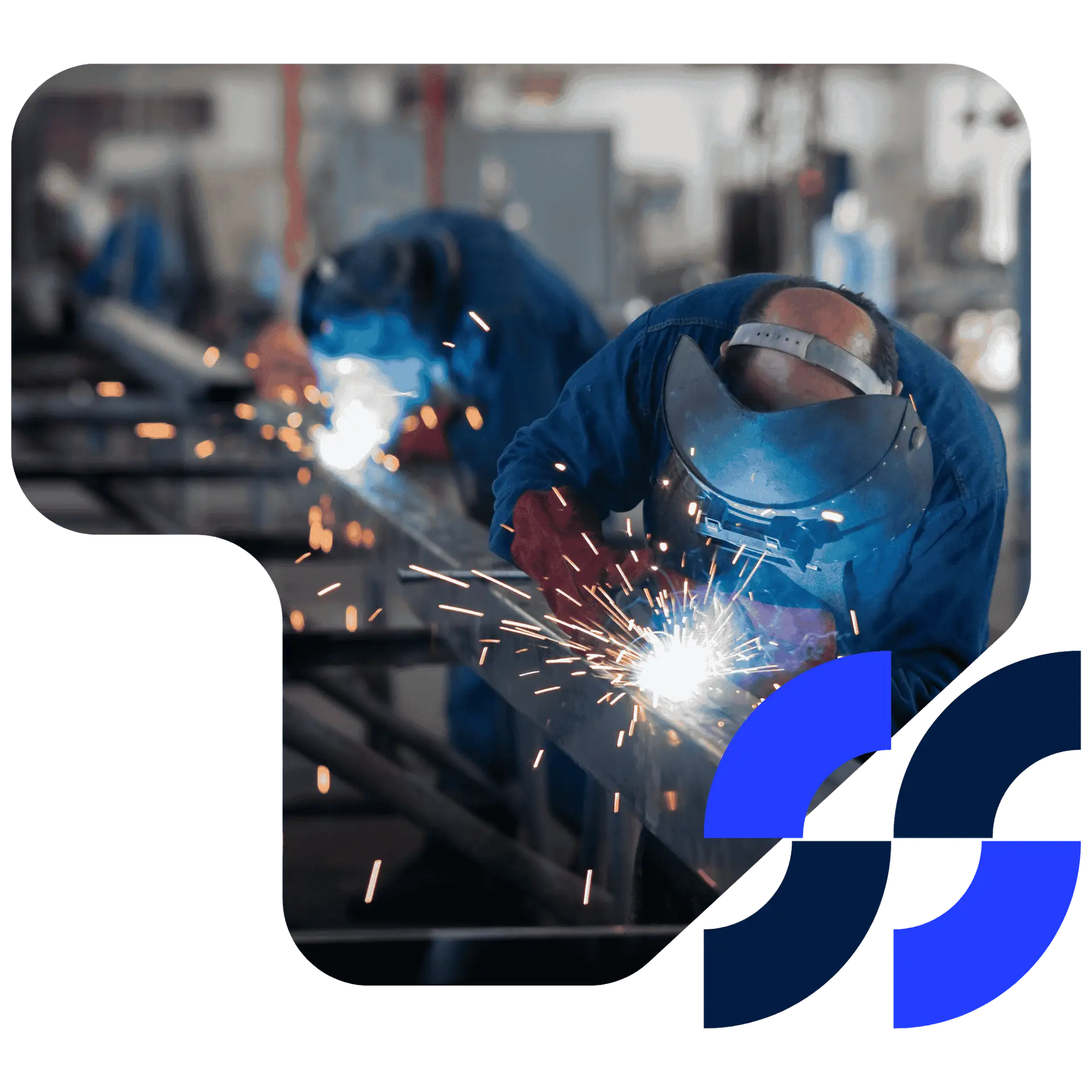 Two workers wearing safety gear welding metal components in an industrial workshop, with sparks flying.