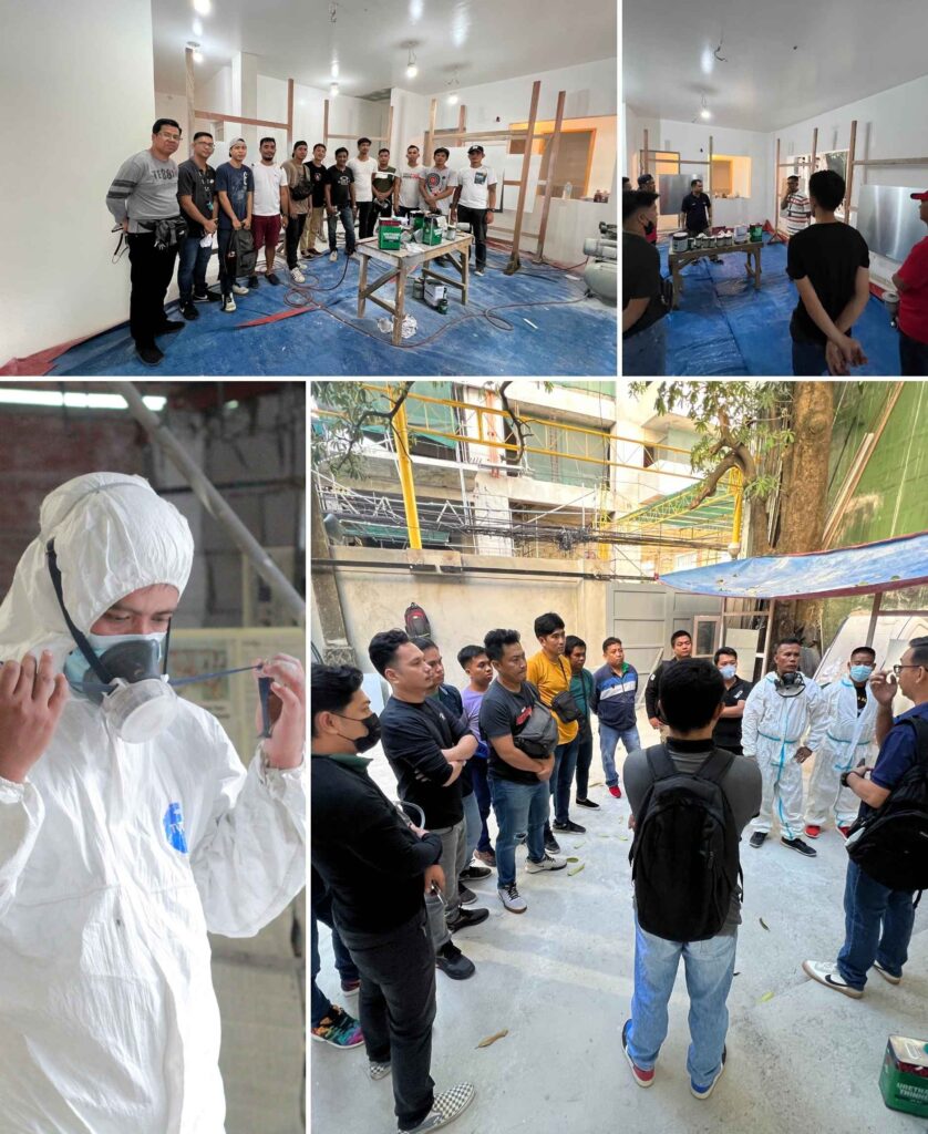 A group of spray painter applicants during a briefing session, preparing for practical applications.