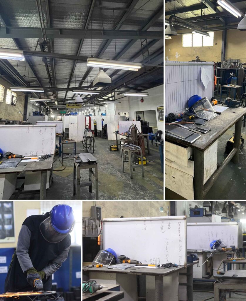 A trade test area equipped for welding practice, showing workstations and safety gear.