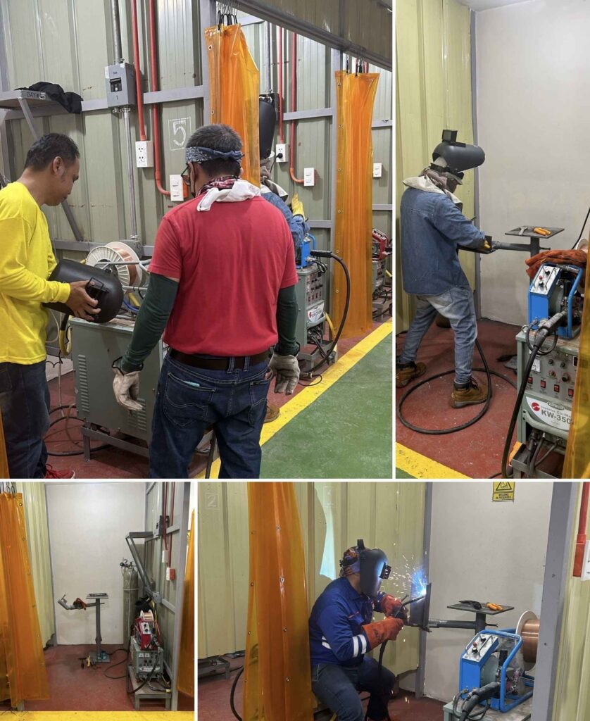 Applicants engaged in practical welding activities inside a controlled training environment.